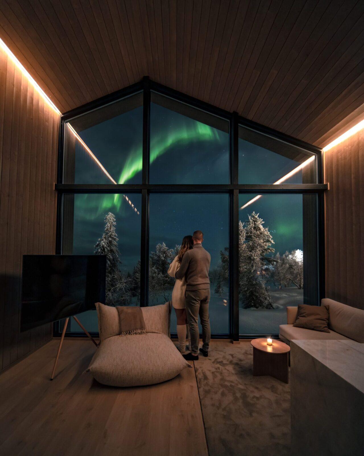 Aurora over a glass igloo at Aurora Village, Ivalo
