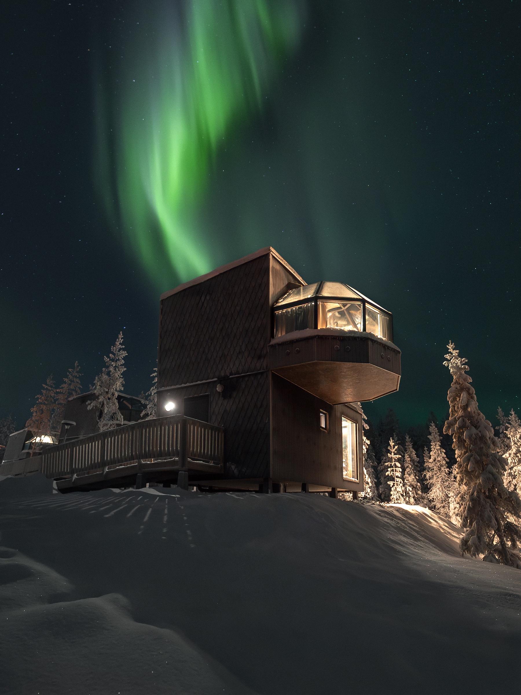 Glass igloos under the northern lights, from above